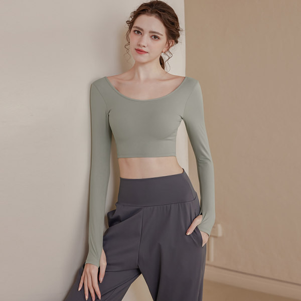 Vienkrāsaina sieviešu sporta blūze ar atkailinātu muguru