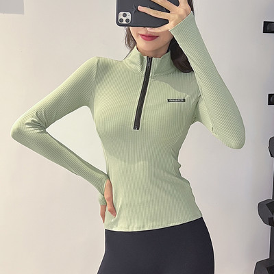 Női sportblúz logóval és cipzárral