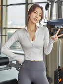 Rövid, cipzáras női blúz galléros sportmodelljén