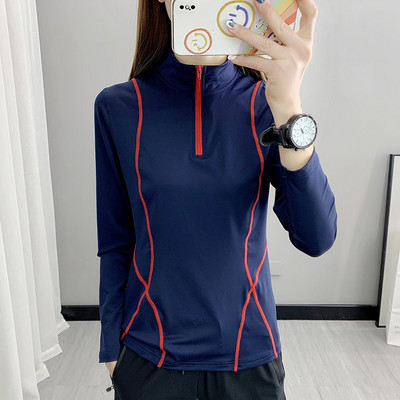 Women`s sports blouse with high collar and zipper