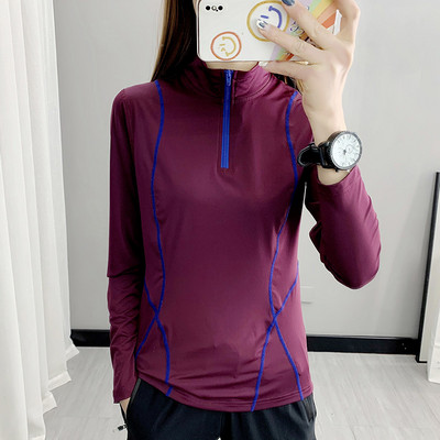 Női sportblúz magas gallérral és cipzárral