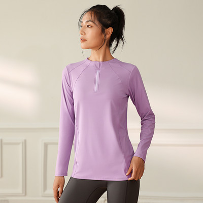 Women`s sports blouse with a round neckline