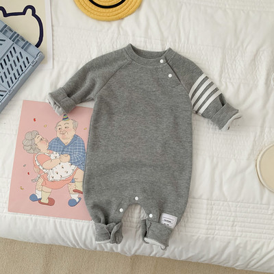 Ziemas kombinezons mazulim ar garām piedurknēm un pogām