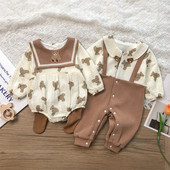 Mazuļa romāns ar lāča apdruku un pogām