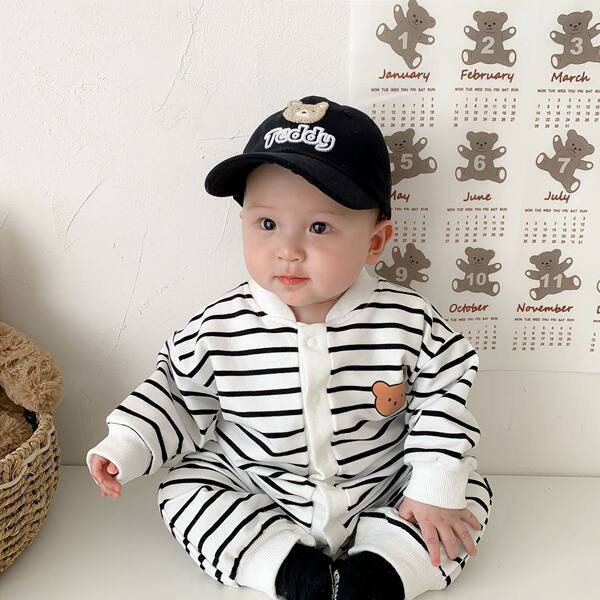 Mazuļa kombinezons ar apdruku un pogām