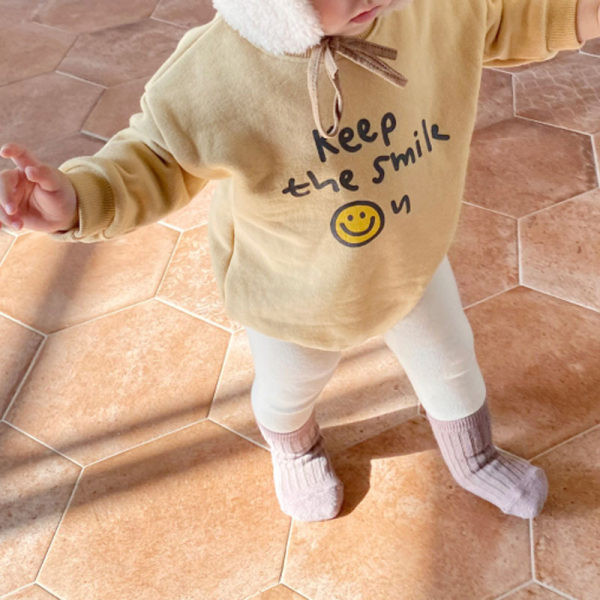 Bērnu bodijs ar apdruku ar garām piedurknēm