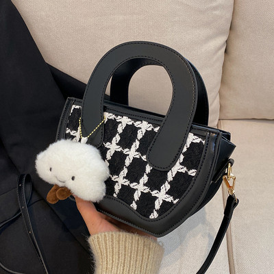 Moderna rokassomiņa ar plecu rokturi