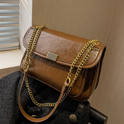 Rokassomiņa ar ķēdīti un metāla aizdari