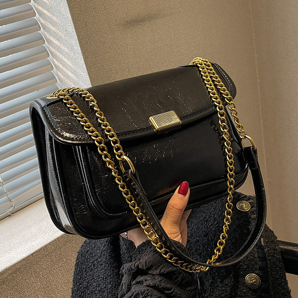 Rokassomiņa ar ķēdīti un metāla aizdari