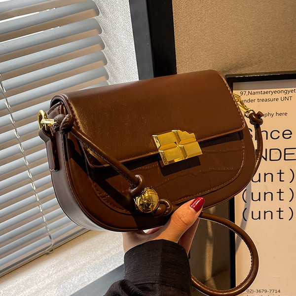 Maza soma ar magnētisku sprādzi un plecu rokturi