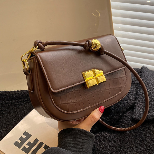 Maza soma ar magnētisku sprādzi un plecu rokturi