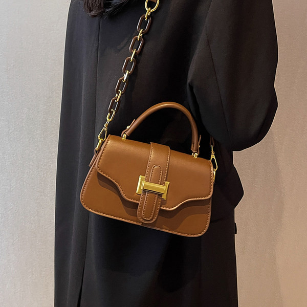 Moderna torbica s dvije ručke za rame od umjetne kože