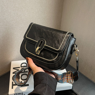 Ručna torbica sa širokom ručkom za rame i patentnim zatvaračem