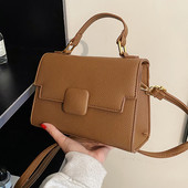 Moderna sieviešu ādas soma ar diviem rokturiem