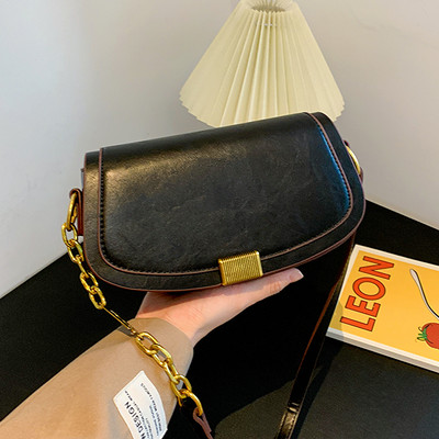 Moderna ženska torba s dugom ručkom i metalnom kopčom