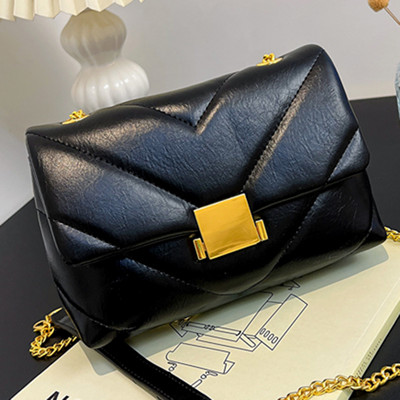 Ženska elegantna kožna torba s metalnom kopčom