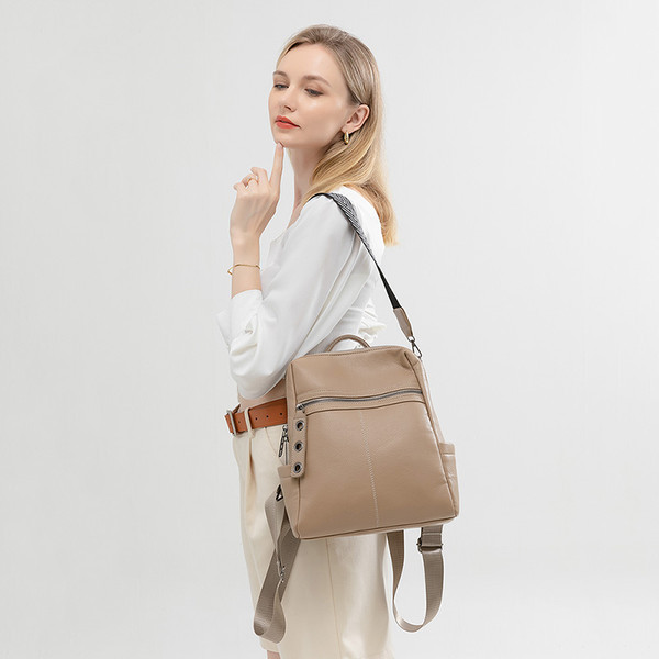 Női hátizsák hosszú fogantyúval és zsebbel