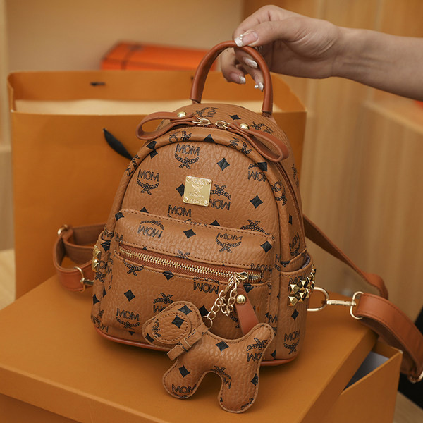 Új modell kis női bőr hátizsák fém emblémával