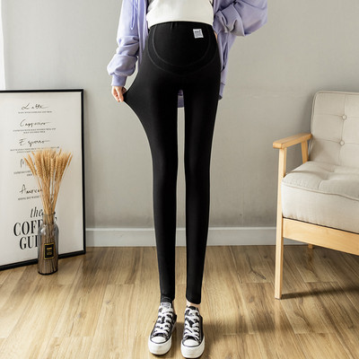 Magas derekú rugós kismama leggings logóval