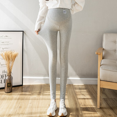 Magas derekú rugós kismama leggings logóval