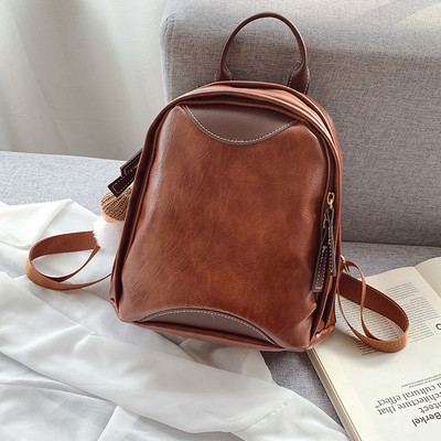 Mali ženski ruksak s patentnim zatvaračem