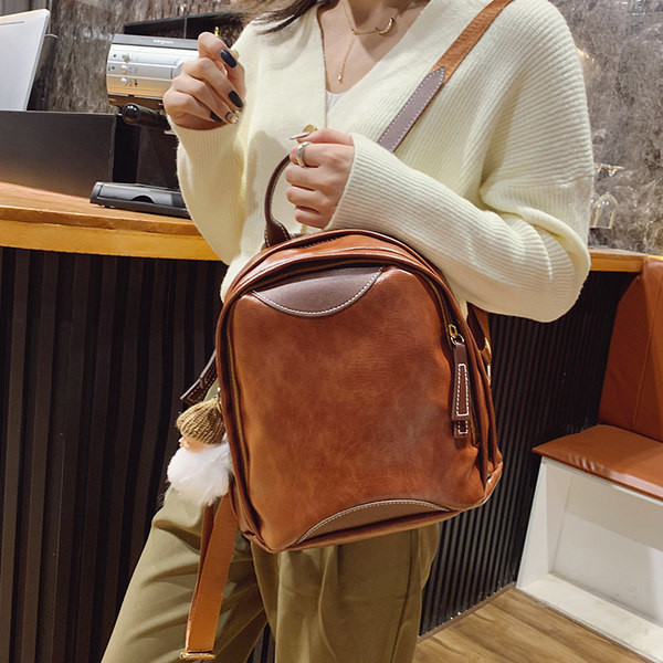 Mali ženski ruksak s patentnim zatvaračem