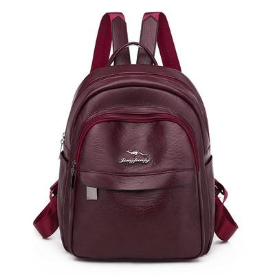 Stílusos női hátizsák műbőrből, fém elemmel