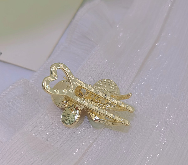 Златиста фиба за коса с камъни