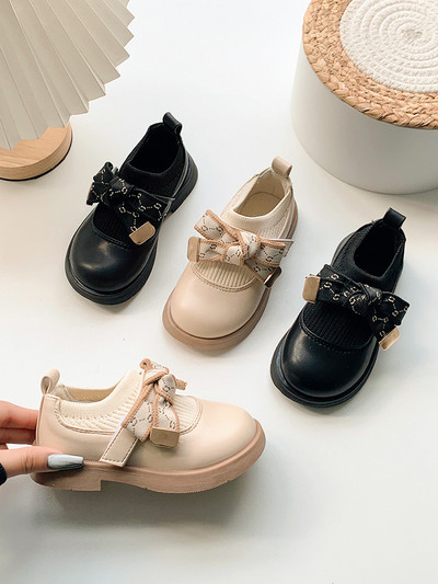 Children`s shoes for girls made of eco leather with a ribbon