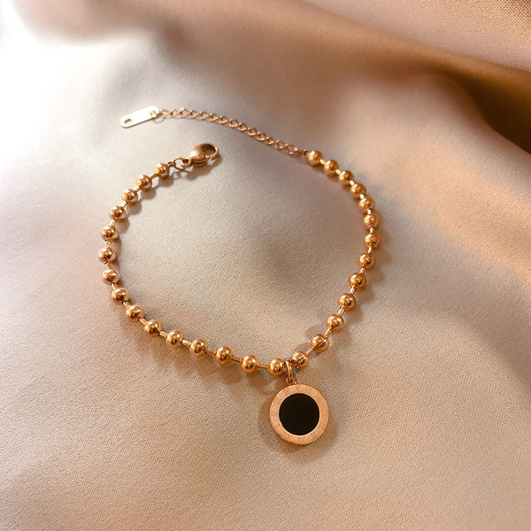 Bratara de dama din diverse elemente metalice