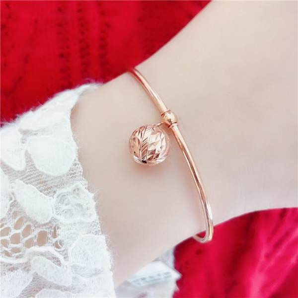 Γυναικείο βραχιόλι με - μεταλλικό μενταγιόν