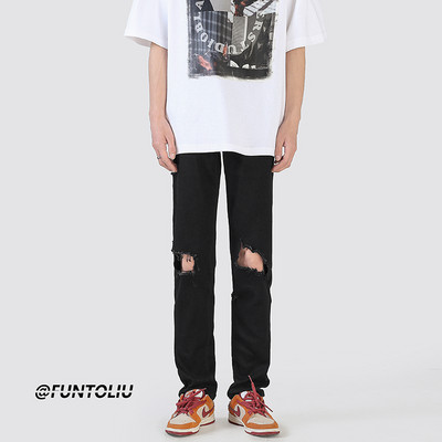 Muške crne poderane traperice s uzorkom