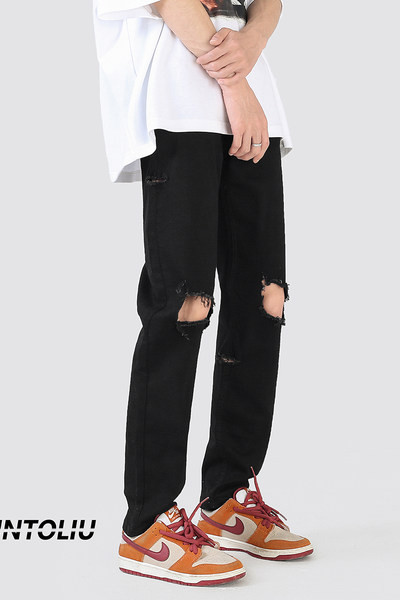 Muške crne poderane traperice s uzorkom