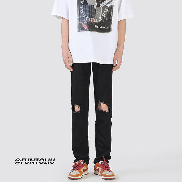 Muške crne poderane traperice s uzorkom