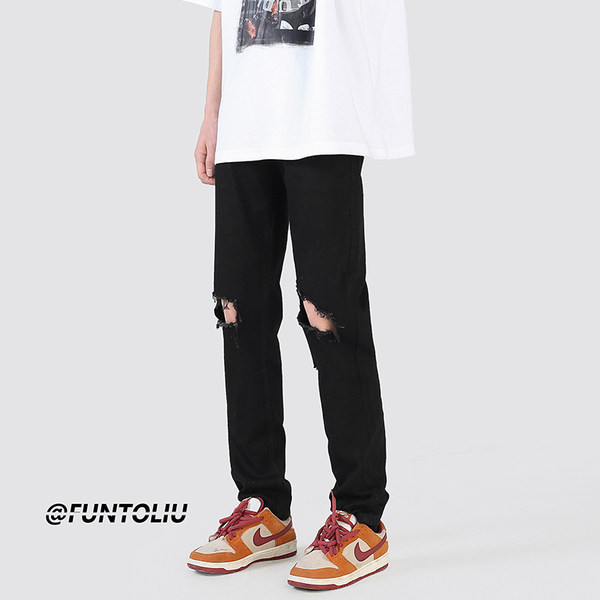 Muške crne poderane traperice s uzorkom