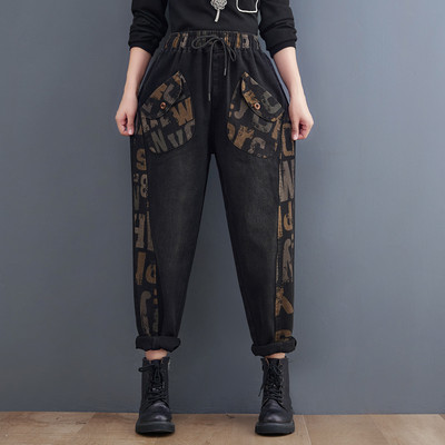 Naiste fliisist teksapüksid lai paelte, tasku ja trükiga mudel