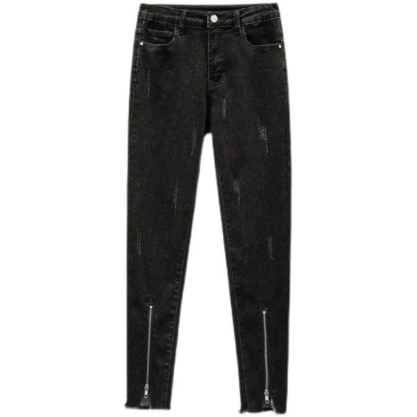 Kõrge vöökohaga naiste liibuvad teksad, mille säärtel on tõmblukk