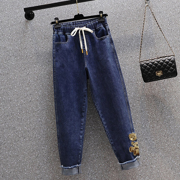 Plataus modelio moteriški džinsai su raišteliais ir siuvinėjimais