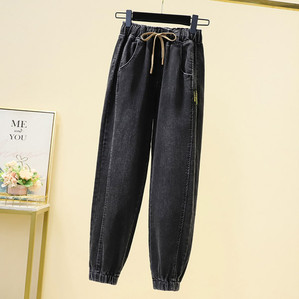 Moteriški džinsai su raišteliais ir tamprėmis ant kojų