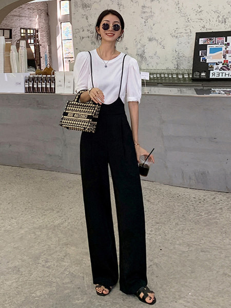 Γυναικεία φαρδιά φόρμα μοντέλου με ψηλόμεσο και τιράντες