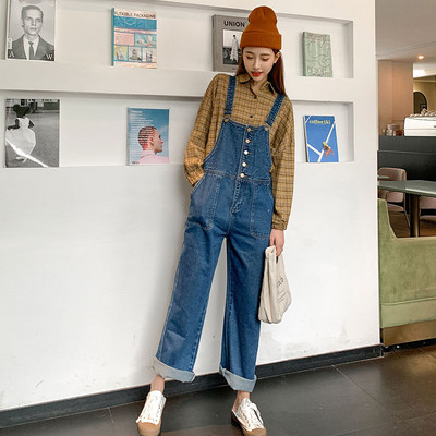 Tasku ja nööpidega teksariidest kombinesoon