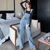 Naiste teksakombinesoon, millel on rebenenud motiivid ja laiad sääred