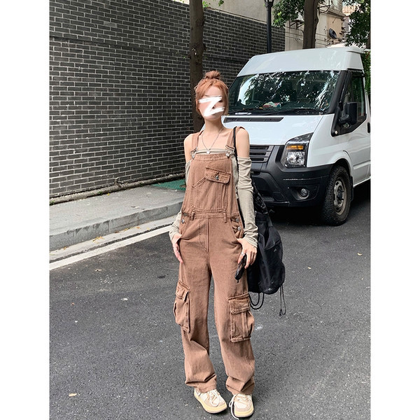 Ležerni ženski traper kombinezon s džepovima sa strane