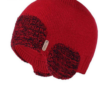 Ženska zimska kapa s perom