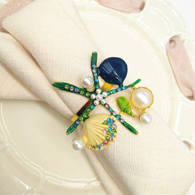 6 tk meritähe salvrätikurõngaid, pärlikivist ookeani merendussalvrätikuhoidjad pulmapeo jaoks, lauakaunistused jne