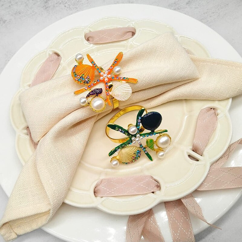 6 tk meritähe salvrätikurõngaid, pärlikivist ookeani merendussalvrätikuhoidjad pulmapeo jaoks, lauakaunistused jne