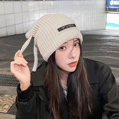 Γυναικείο χειμωνιάτικο πλεκτό καπέλο με γράμματα και κορδόνια