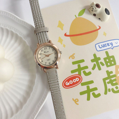 Stiilne ümara kujuga ja ökonahast rihmaga naiste käekell