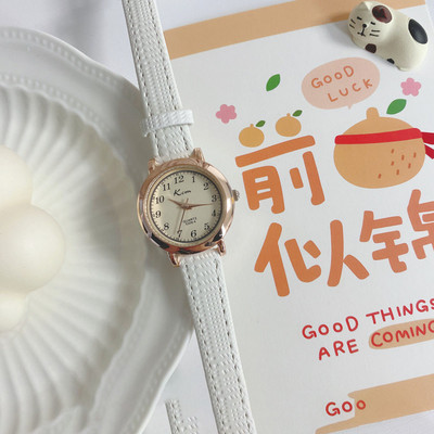 Stiilne ümara kujuga ja ökonahast rihmaga naiste käekell