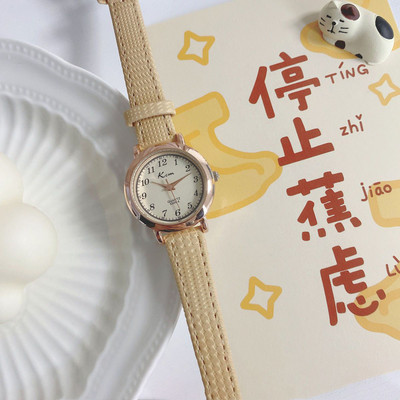 Stiilne ümara kujuga ja ökonahast rihmaga naiste käekell